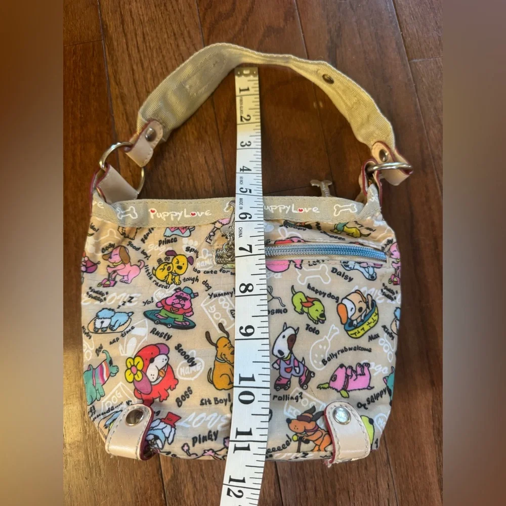 Puppy Love Purse with 2 top zippers and sm side zip.
Cream with bone zip pulls - Picture 6 of 10